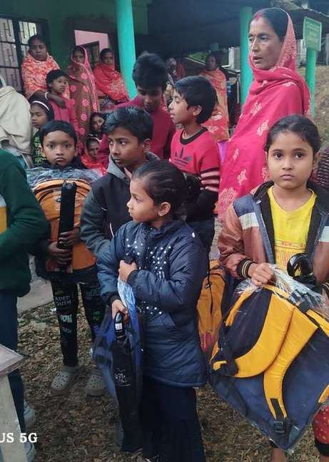A schoolbag being handed to a student