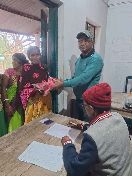 Winter garments being distributed indoors
